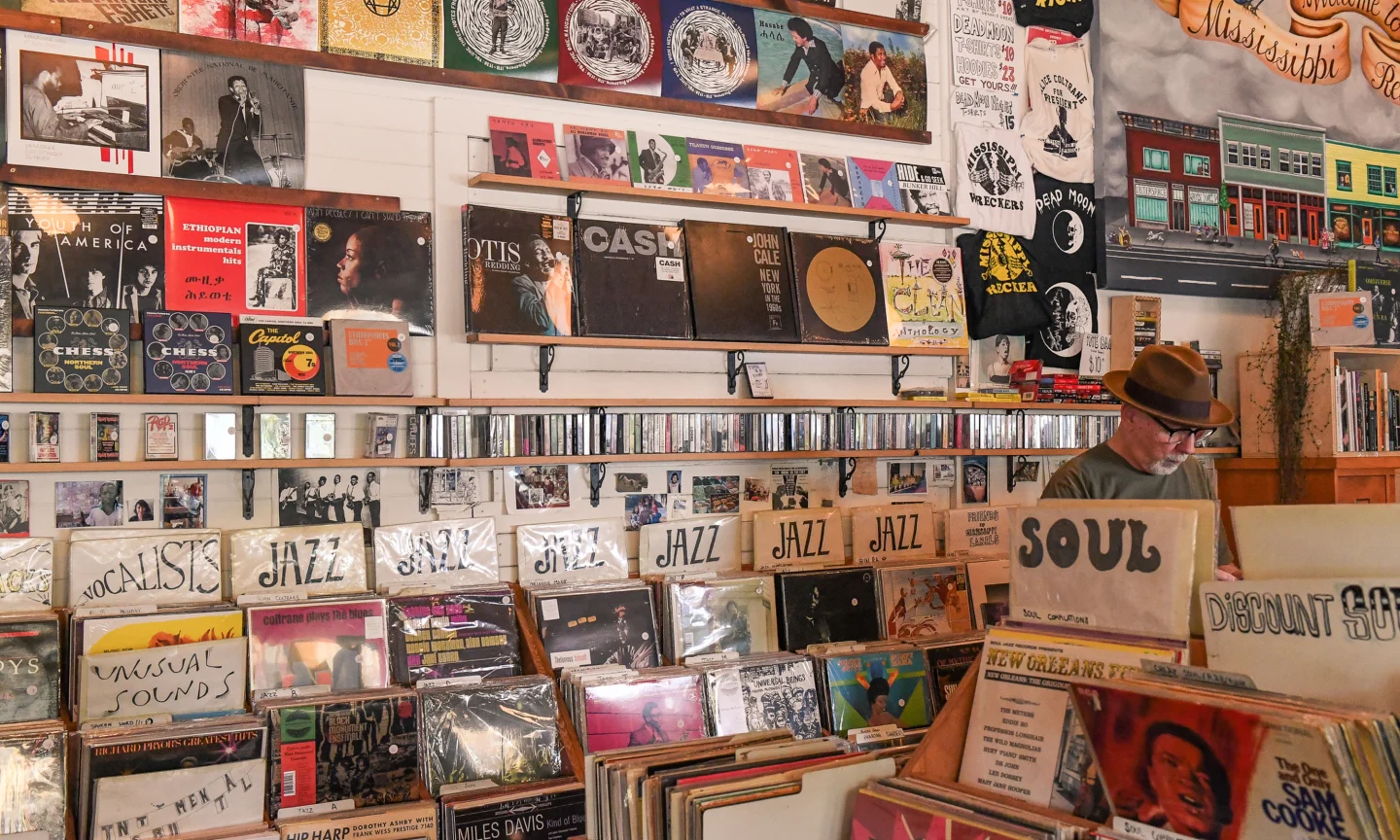 Image of a record store with vinyls from ceiling to floor. Imaged source by Portland Record Stores